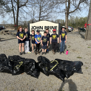 1. Cub Scout Pack 208 members collect litter along the walking paths at John Prine Memorial Park during their annual clean-up project. PHOTO | Submitted